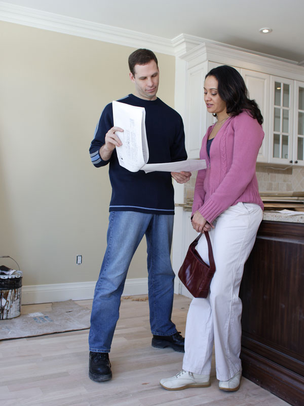 going over construction plans in home